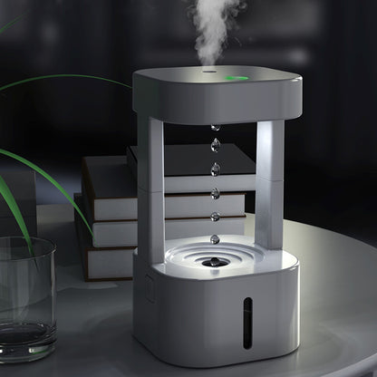 Humidifier emitting mist on a dark background