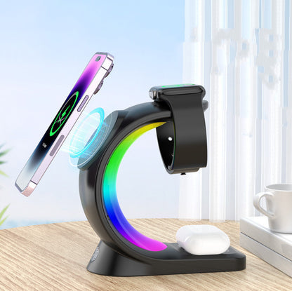 Multi-device charging stand with smartphone, smartwatch, and wireless earbuds on a wooden surface.