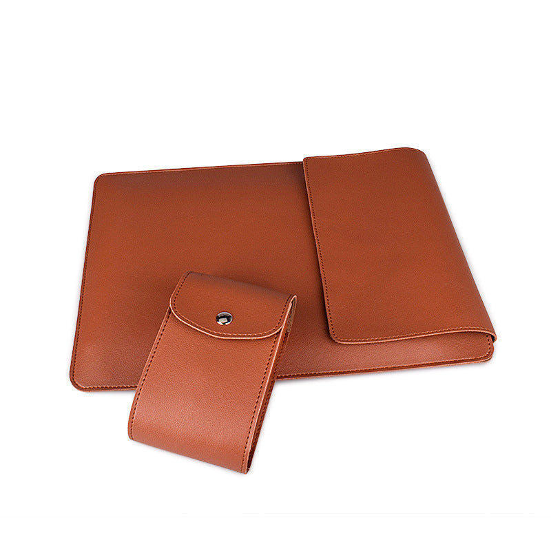 Brown leather clutch and wallet set on a white background