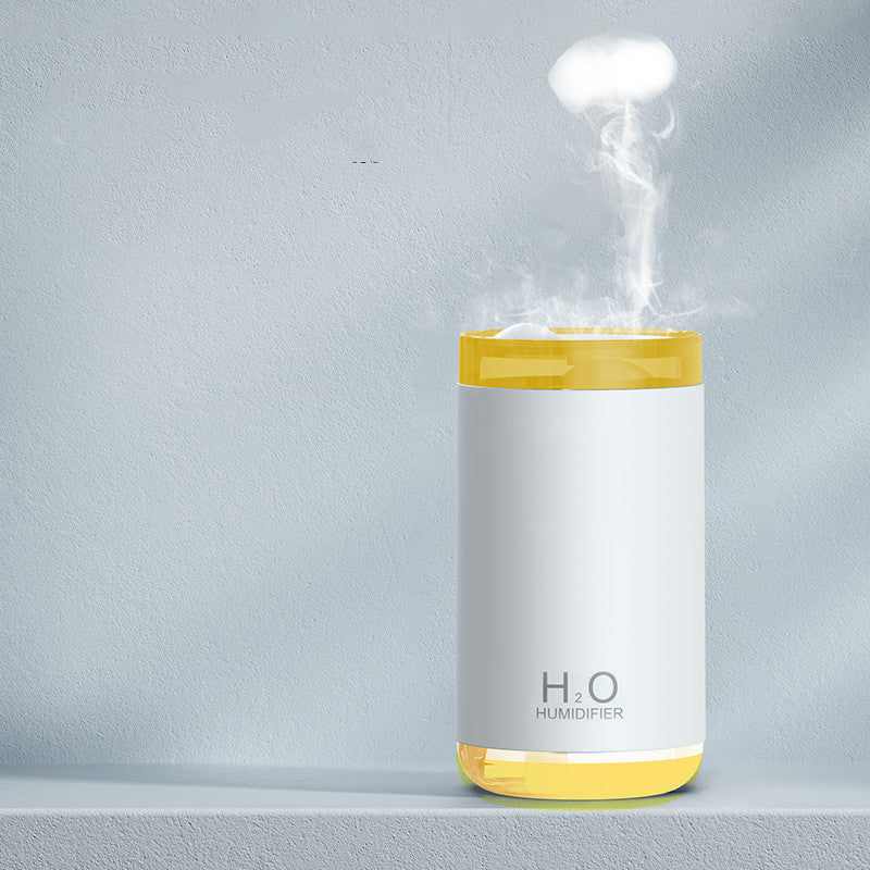 H2O humidifier emitting steam on a gray background