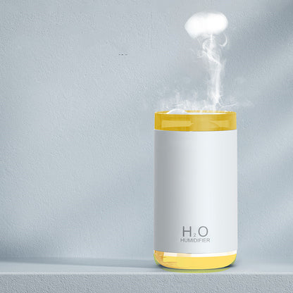 H2O humidifier emitting steam on a gray background