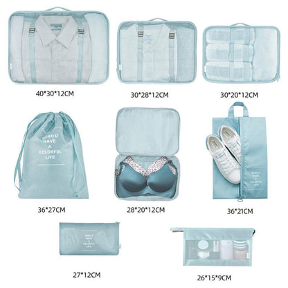 Set of blue packing cubes and bags with dimensions displayed