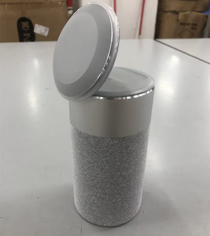Round trash bin with a textured design on a white surface