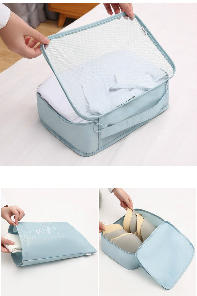 Light blue travel storage bag with clear lid, showing its contents on a white surface.