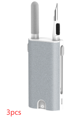 Gray electronic device with a stylus-like attachment on a white background