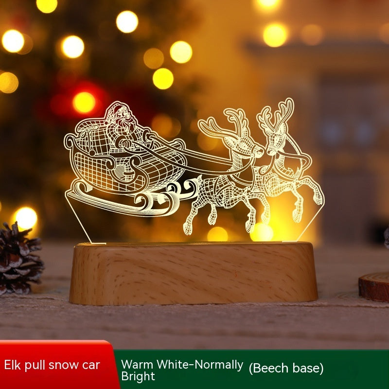 Decorative lamp with reindeer and sleigh design on a wooden base, blurred lights in the background