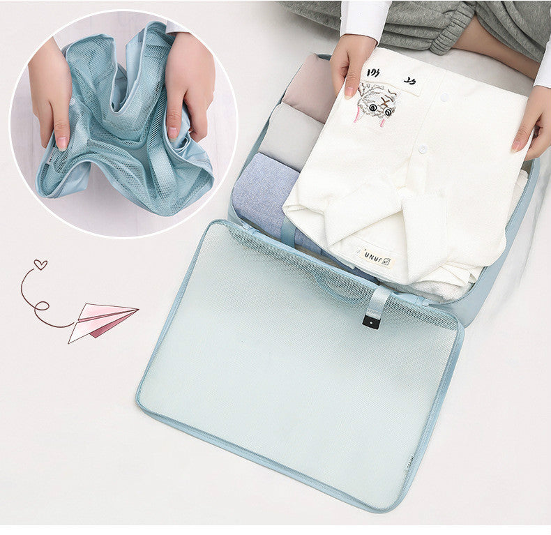 Mesh laundry bag with clothes inside, showing a close-up of a blue garment.