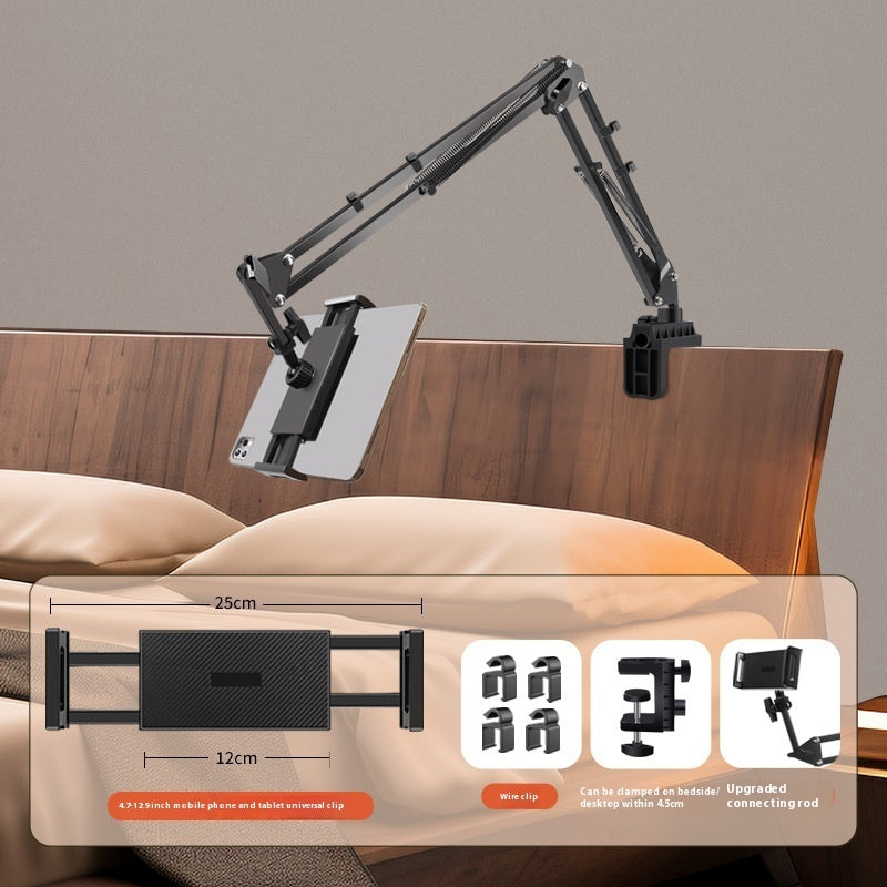 Flexible arm monitor stand with adjustable arm and bracket on a bed.
