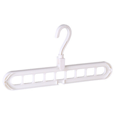 White plastic hanger with multiple hooks on a white background
