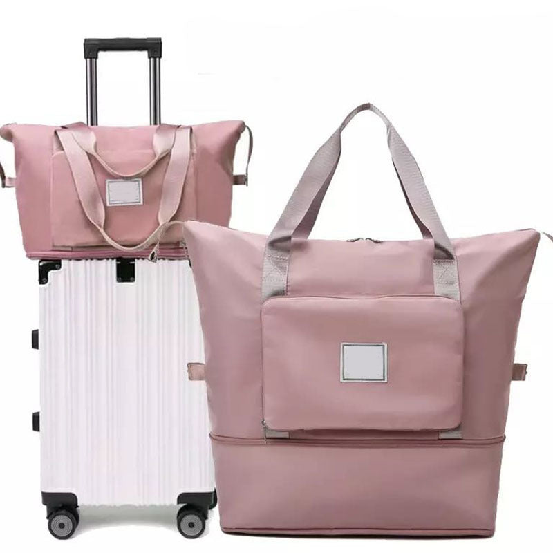 Pink travel bags with a suitcase on a white background