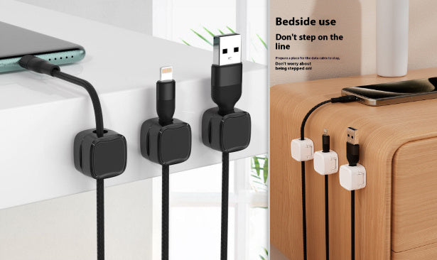 Wall-mounted cable organizer with USB cables on a white wall and wooden surface.