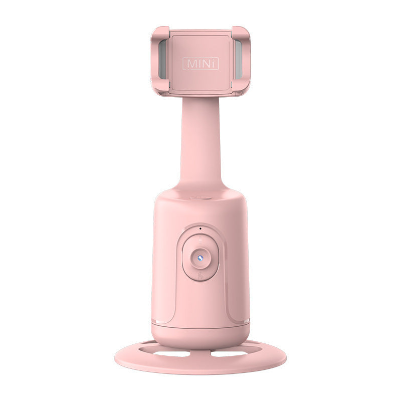 Pink handheld device with a stand on a white background