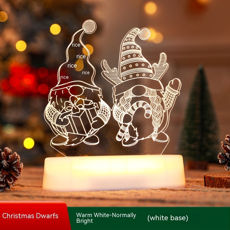 Decorative night light with Christmas dwarfs design on a wooden surface with blurred festive background.