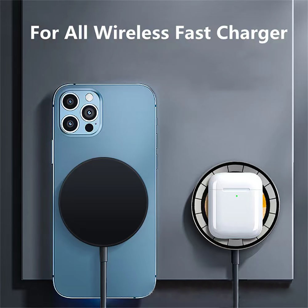 Blue phone with wireless charging pad and white case on gray background