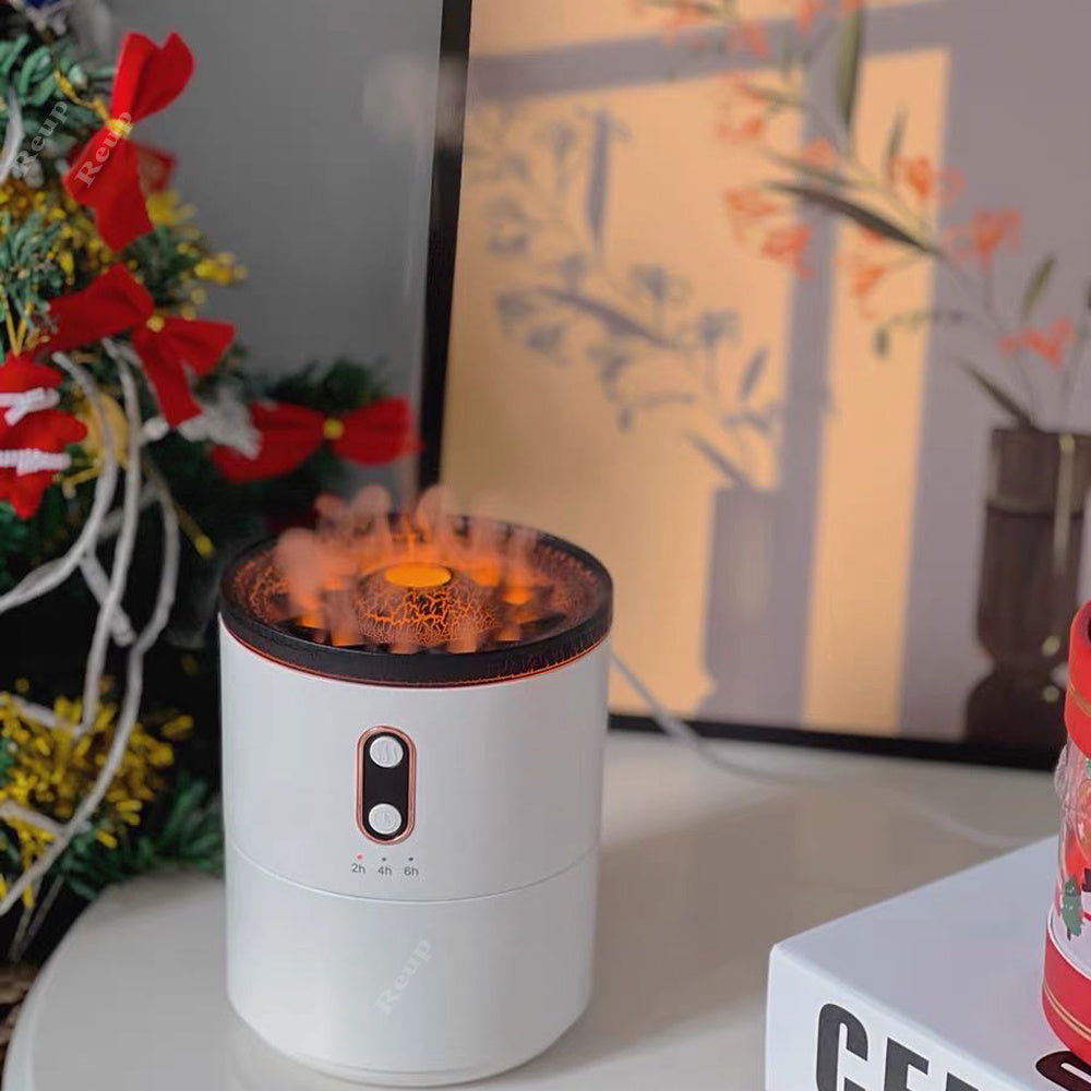 White cylindrical device with flame-like effect on a surface with decorative items in the background