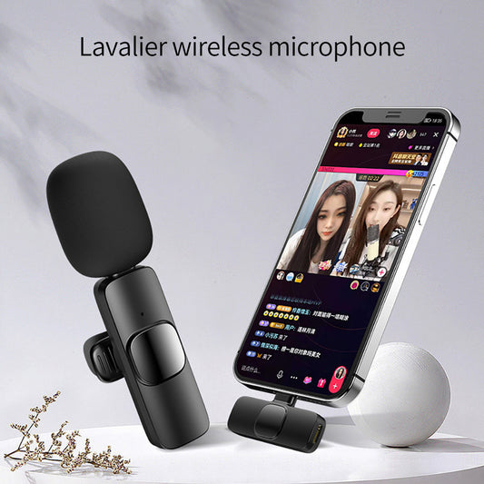 Lavalier wireless microphone with smartphone displaying a video call on a light gray background