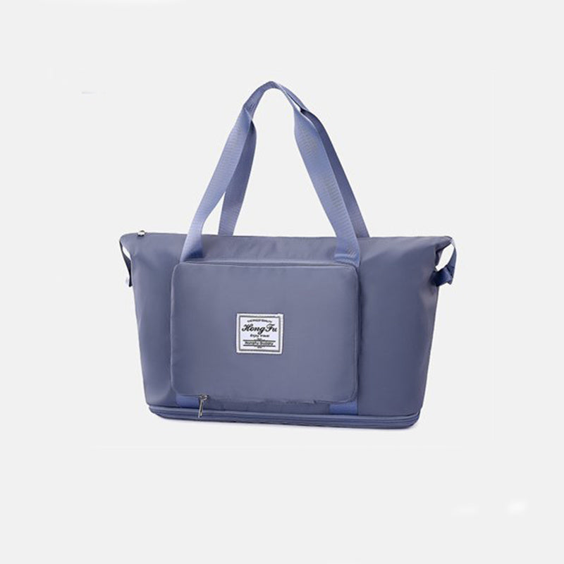 Blue tote bag with a visible brand logo on a light gray background