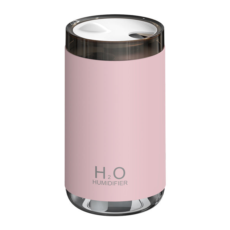 Pink humidifier with 'H2O' branding on a white background