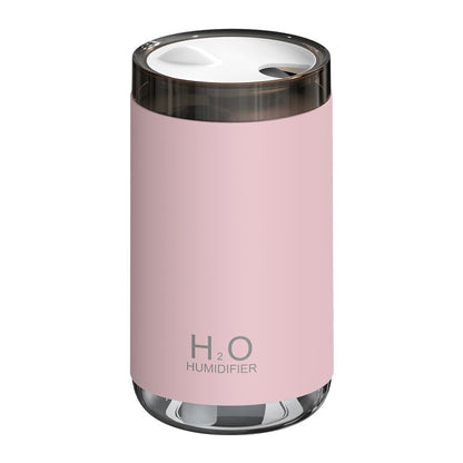 Pink humidifier with 'H2O' branding on a white background