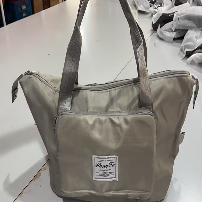 Gray bag with a visible brand label on a white surface