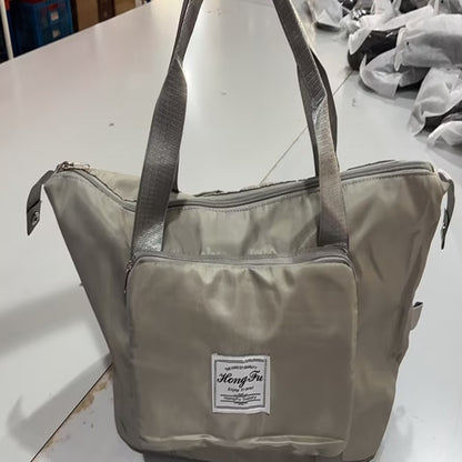 Gray bag with a visible brand label on a white surface