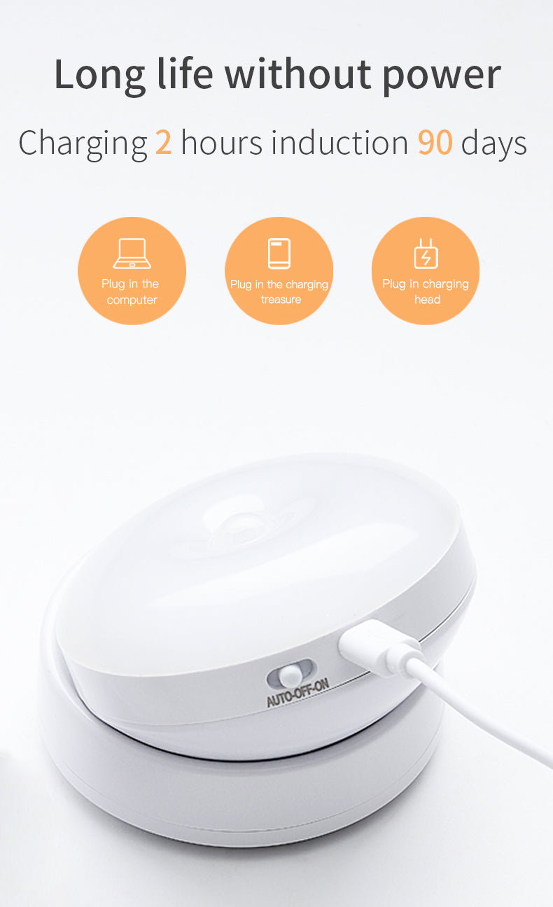 White electronic device with charging cable on a light gray background, featuring text about power life and charging duration.