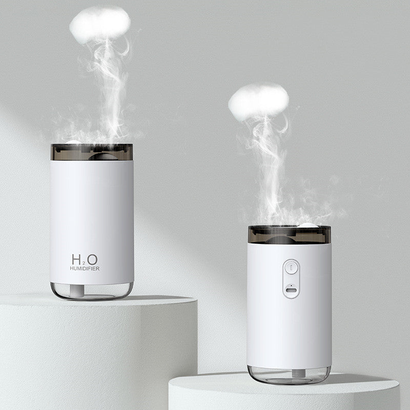 Two white humidifiers emitting steam on a gray background