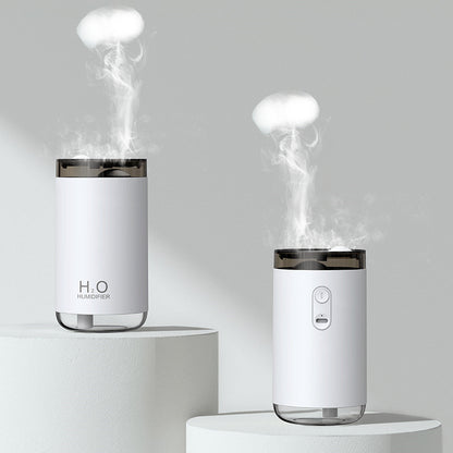 Two white humidifiers emitting steam on a gray background