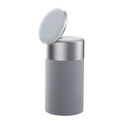 Gray cylindrical container with a silver lid on a white background