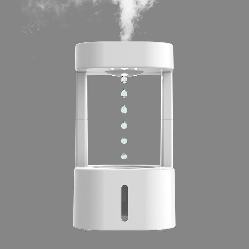 White humidifier emitting steam on a gray background