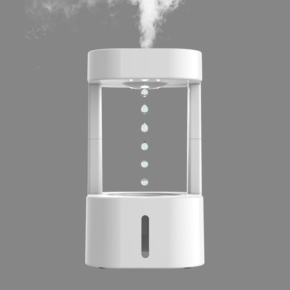 White humidifier emitting steam on a gray background