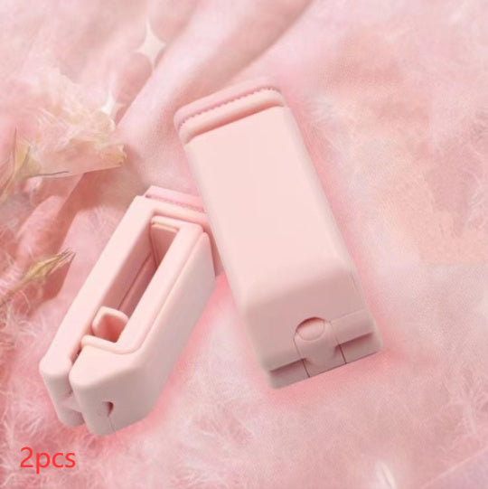 Two pink clips on a soft pink background with '2pcs' text.