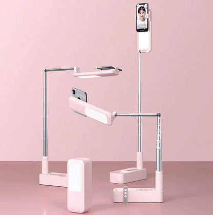 Multi-angle phone holder with lamp on a pink background