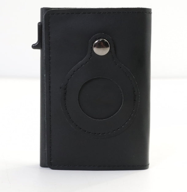 Black leather cardholder with circular design on a white background