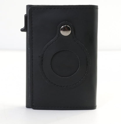 Black leather cardholder with circular design on a white background